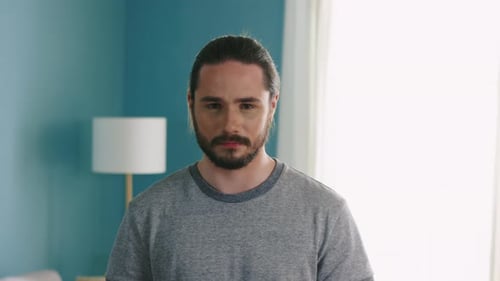 Brunette Man with Dark Eyes Looking at Camera