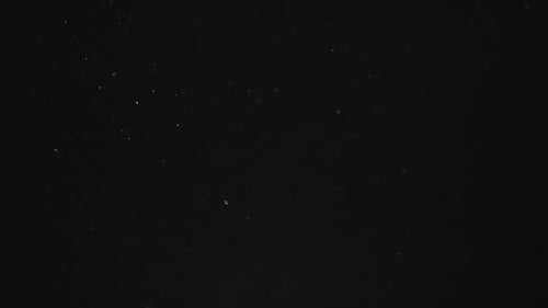 Dark Abstract Background with Moving Particles
