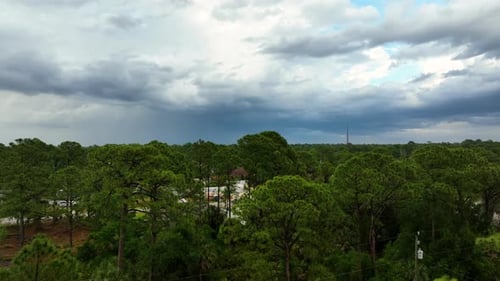Landscape of Dark Ominous Clouds Forming on Stormy Sky Before Heavy Thunderstorm Over Rural Town