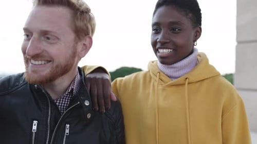 Smiling Young Adults Together in Urban Setting
