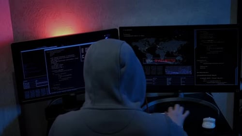 Unrecognizable Hacker Man Typing on Keyboard and Engaging Hacking Into Security Systems