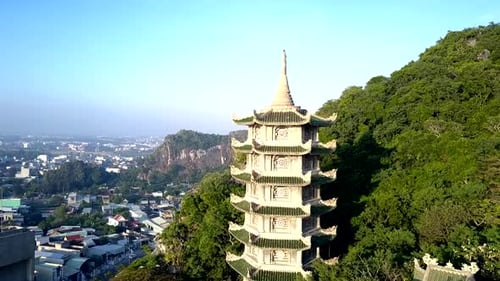 Aerial Motion To Pagoda Among Deep Rainforest Near City
