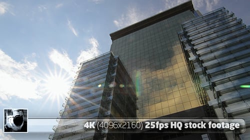 Modern Office Building with Glass Windows and Sunny Skies