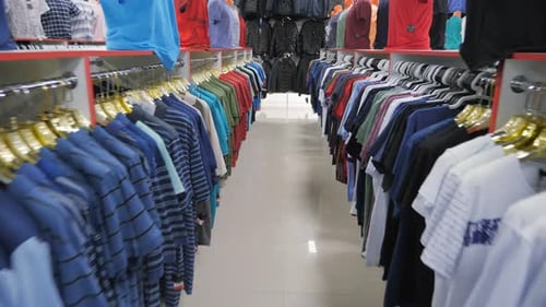 Clothing Store Aisle Showcasing Colorful Shirt Selections