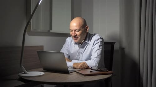 Happy business white senior, caucasian freelance man person watching a funny movie