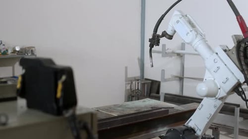 industrial 4.0 concept modern automated robot welding arm machine tool welds metal pipe