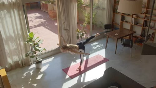 Woman Doing Yoga Poses in Sunny Apartment