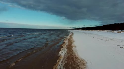 Aerial View at the Baltic Sea, Winter Season Landscape by the Sea in Sunny Day. Snowy Beach at Winte