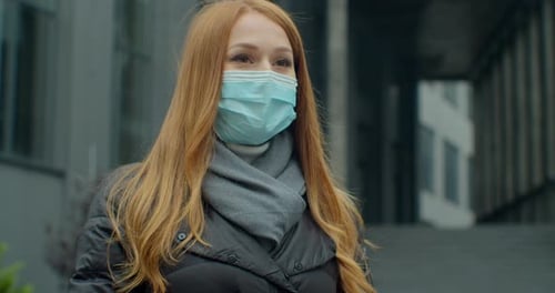 Woman Wearing Surgical Mask Outside Urban Building