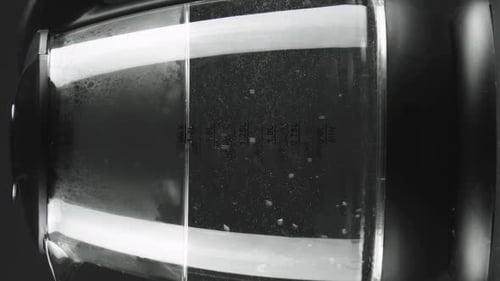 Macro Shot of Water Boiling in Glass Kettle