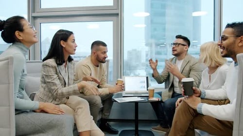 Multiracial Group of People Women and Men Talking Discussing Work Brainstorming in Office