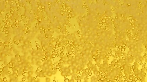 Glass of beer with bubbles.