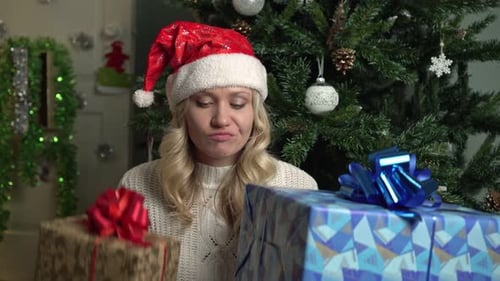 Christmas or New Year Angry Disgruntled Woman Throws Out Gift Boxes