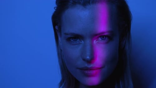 Woman's Face in Blue and Pink Light