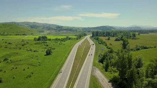 Aerial: Flying Over Highway in the Highlands. View of the Tourist City