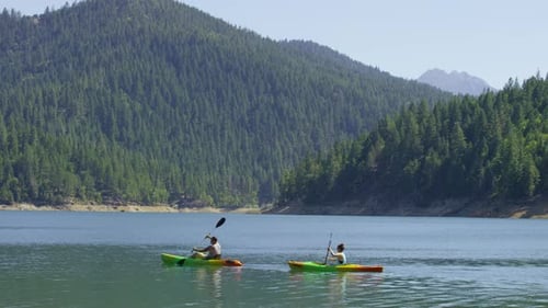 Couple kayaking in lake