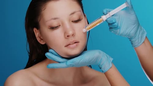Woman Receiving Cosmetic Injection on Face