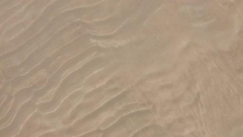 Abstract Ripples on Sandy Beach Shoreline