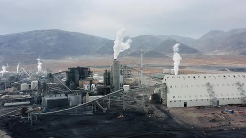 Aerial Dirty Industrial Manufacture with Pipes Polluting the Atmosphere USA
