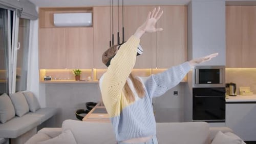 Woman Using Virtual Reality Headset in Modern Apartment