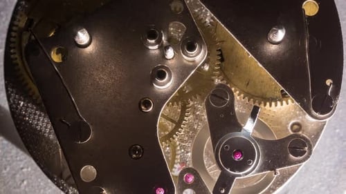 Close up view of Vintage old clock mechanism working.