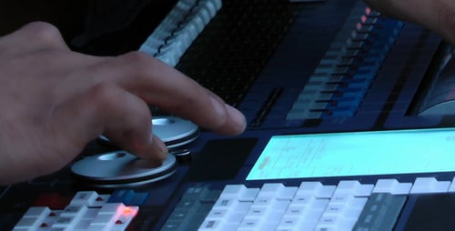 Hands Operate Modern Sound Mixing Console in Studio