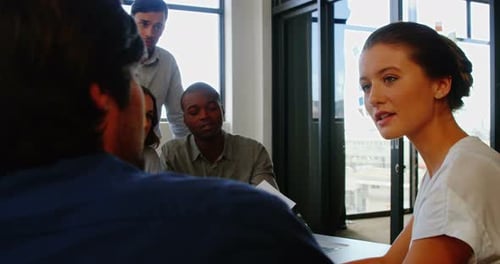 Team Discusses Charts in Modern Workplace