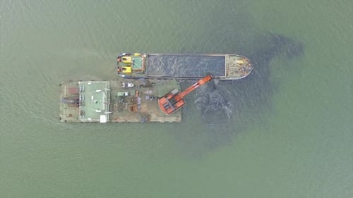 Dredging Vessel Excavating Sediment in the Ocean