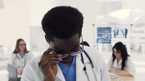 Smiling Young Doctor Portrait in a Clinic Setting