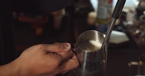 Barista Making Latte Art in Specialty Coffee Shop