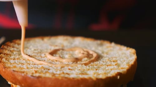 Chef Assembling a Burger in Slow Motion.