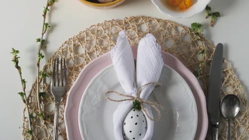 Festive Easter Table Setting with Decorated Eggs