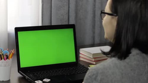 Woman Teacher Making Online Distance Education Video Call on Laptop Green Screen