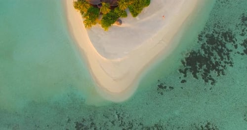 Aerial drone view of a scenic tropical island in the Maldives.