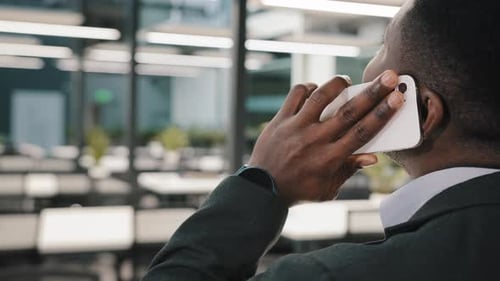 Man Talking on Phone in Modern Office