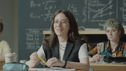 Girl Asking Question during University Lesson