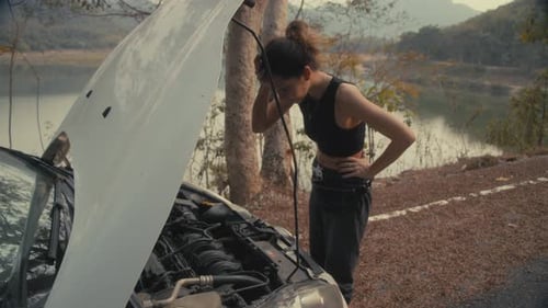 Woman Having Car Troubles on the Road