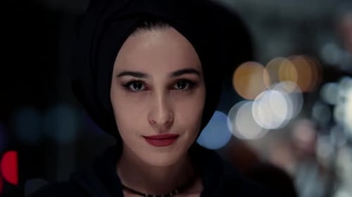 Striking Woman Portrait with Bokeh Lights at Night