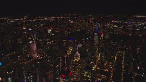 Forwards Fly Above City at Night