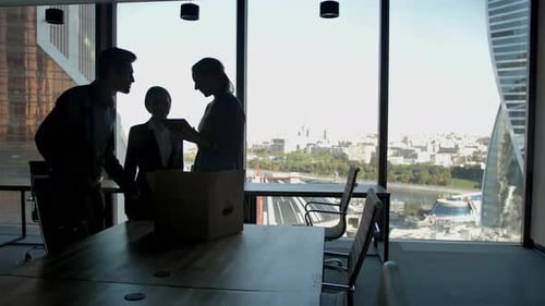 Several Silhouettes of Attractive Handsome Businesspeople Interacting Business Center.