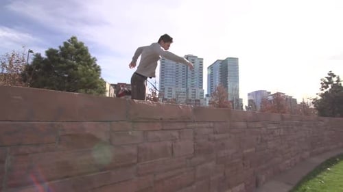 Man Doing Parkour in Urban Park