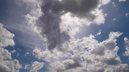 White Clouds Float Across Blue Sky
