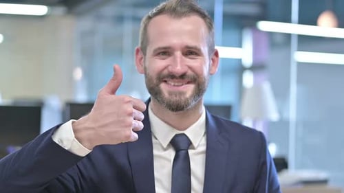 Man in Suit Gives Thumbs Up of Approval