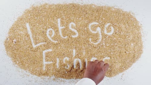 Handschrift auf Sand Lets Go Fishing