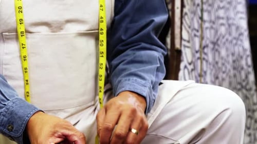 Craftsman Hammers Nail into Wood