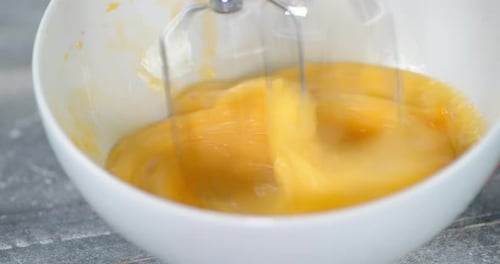 Close up of Eggs Being Mixed in Bowl