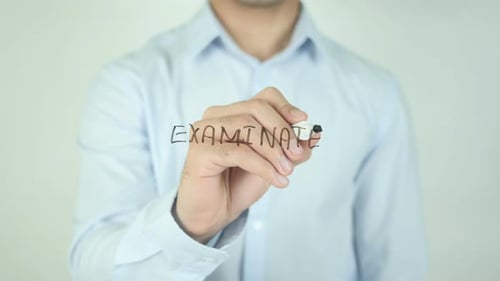 Man Writing Examined on Transparent Screen