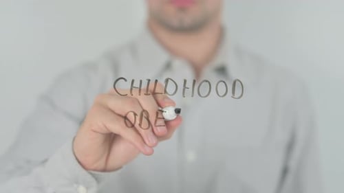 Writing Childhood Obesity Message on a Clear Surface