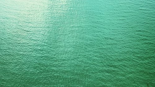 Aerial Top Down View From High Altitude of Green Sea Water Texture