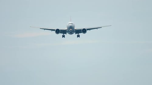 Airplane Flying Straight Ahead Preparing to Land